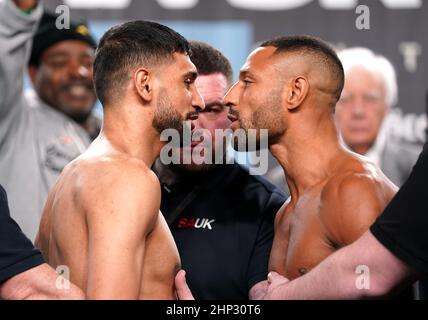 Amir Khan (left) and Kell Brook during the weigh in at the Exchange Hall, Manchester. Picture date: Friday February 18, 2022. Stock Photo