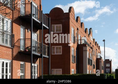 Gresham Mill in Old Woking, Surrey, England, UK, former mill and printing works now converted into apartments and houses, with Flemish style facade Stock Photo