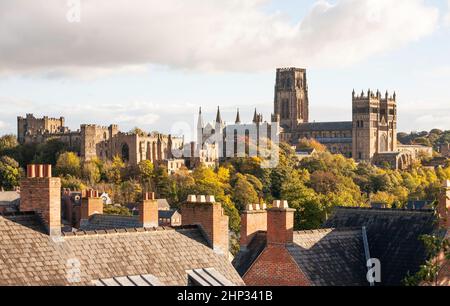 Durham castle and cathedral seen above rooftops in autumn, Durham City, Co. Durham, England, UK Stock Photo