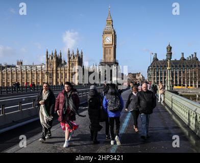 London, UK. 18th Feb, 2022. February 18th, 2022. London, UK. People walk across Westminster Bridge during Storm Eunice. A rare red weather warning - the highest alert, meaning a high impact is very likely - has been issued by the Met Office due to the combination of high tides, strong winds and storm surge. Picture date: Friday February 18, 2022. Credit: Kieran Cleeves/Alamy Live News Stock Photo