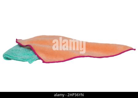 Household cleanliness and hygiene. Close-up of a blue and a yellow cleaning cloth isolated on a white background. Microfiber cleaning cloth. Macro. Stock Photo