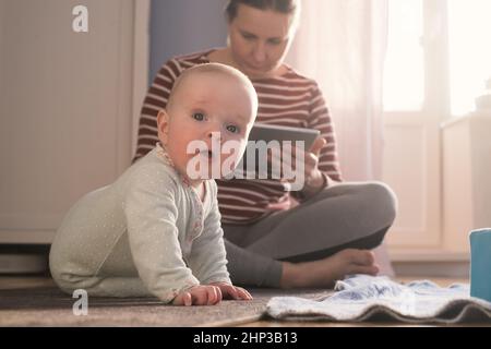 Caucasian mother with baby spending time together. Stock Photo