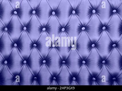 Violet lavender capitone textile background, retro Chesterfield style checkered soft tufted fabric furniture diamond pattern decoration with buttons, Stock Photo