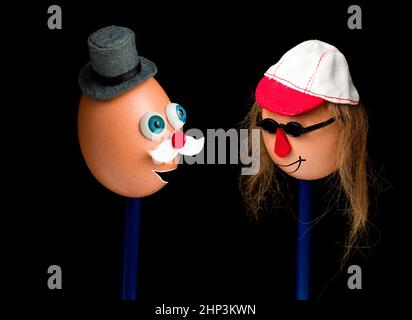 Funny couple made of eggs with faces and hats Stock Photo