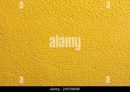 Microfiber Towel yellow Terry Texture Wrist Watch. Microfiber cloth with close-up. Fabric structure background. Fabric blue pattern. Cleaning service. Stock Photo
