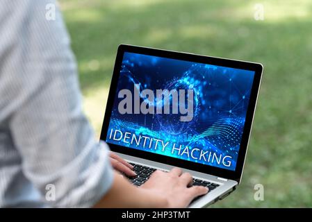 Writing displaying text Identity Hacking, Conceptual photo criminal that steal your personal information using malware Woman Typing On Laptop In The P Stock Photo