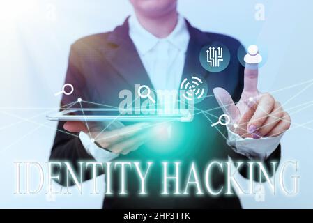 Hand writing sign Identity Hacking, Business approach criminal that steal your personal information using malware Woman In Suit Holding Tablet Pointin Stock Photo