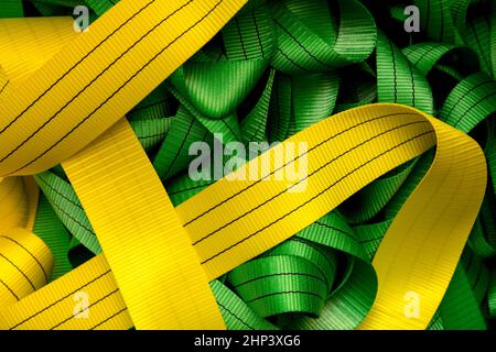 Industrial sewing machine sews a webbing sling. Manufacture of textile slings and tie straps Stock Photo