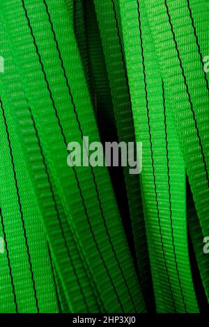 Industrial sewing machine sews a webbing sling. Manufacture of textile slings and tie straps Stock Photo