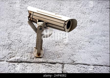 a security camera is hanging on the wall. High quality photo Stock Photo