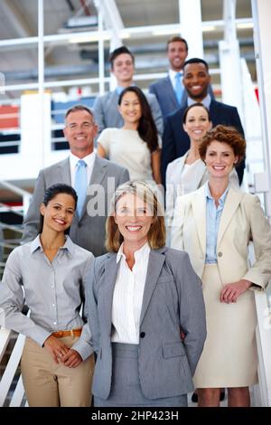 She leads the way. Portrait of a diverse group of businesspeople in the office. Stock Photo