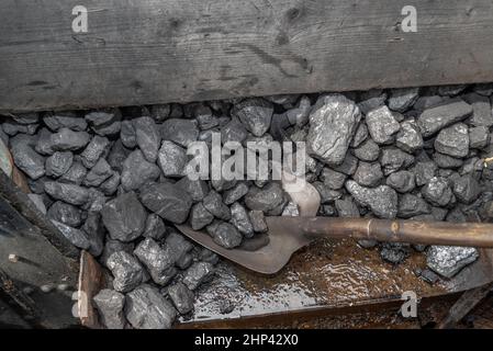A coal shovel in an old steam train locomotive Stock Photo