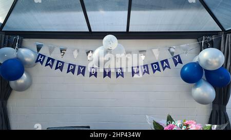 Celebration banner. Happy birthday party background with golden ribbons, confetti and balloons. Realistic anniversary Stock Photo