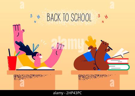 Happy little kids sit at desks feel excited get back to school. Smiling small teen children feel joyful in classroom. Offline lessons and classes. Loc Stock Photo