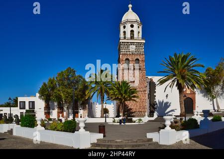 The church Parroquia de Nuestra Senora de Guadalupe de Teguise in the town Tahiche, Lanzarote, Spain. In front the Plaza de la constitucion. Image tak Stock Photo