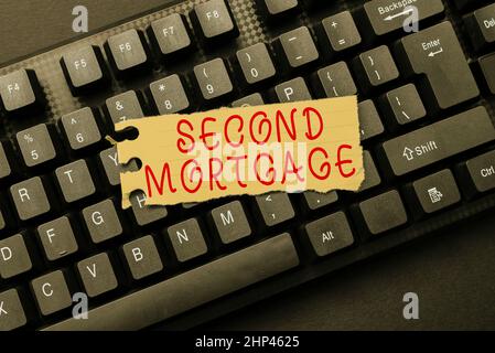 Conceptual caption Second Mortgage, Word Written on lien on property which is subordinate to more senior one Downloading Documents Concept, Uploading Stock Photo