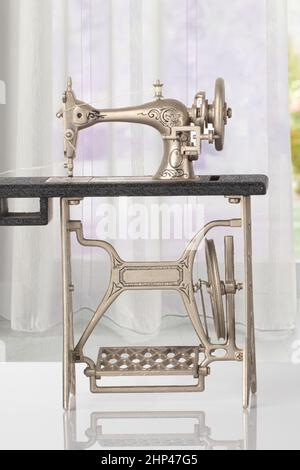 Vintage Sewing machine isolated over a white background Stock Photo - Alamy