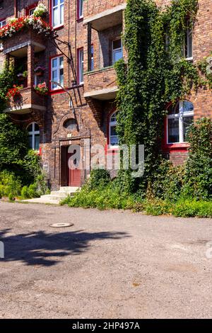 Katowice, Nikiszowiec, Poland - July 29, 2021 : Historic housing estate for coal miners from the beginning of the 20th century. Built as a district of Stock Photo