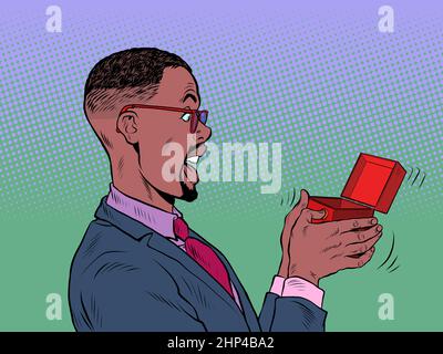 The male businessman is surprised box valentine surprise greeting, love romance. Pop Art Retro Vector Illustration 50s 60s Vintage kitsch Style Stock Photo