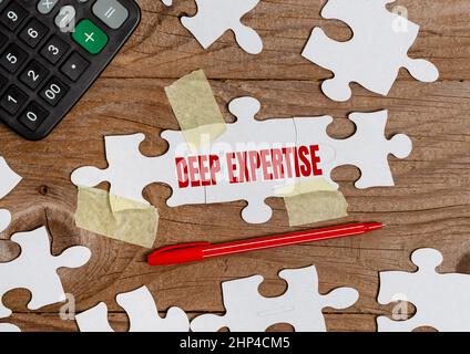 Sign displaying Deep Expertise, Word Written on Great skill or broad knowledge in a particular field or hobby Building An Unfinished White Jigsaw Patt Stock Photo