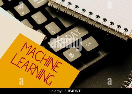 Handwriting text Machine Learning, Word Written on the concept that a computer can learn new data itself Typing Online Tourist Guidebook, Searching In Stock Photo