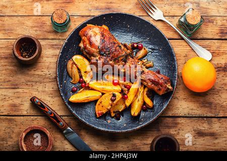 Baked turkey meat with oranges. Delicious roasted turkey leg, Thanksgiving dinner Stock Photo