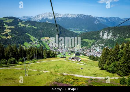 Chair lift above the village of La Clusaz in summer, France Stock Photo