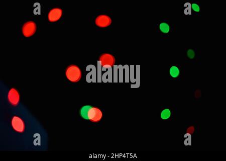 closeup the red green lighting bubbles over out of focus black background. Stock Photo