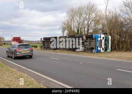 Ashford, Kent, UK. 18 Feb, 2022. UK Weather: Storm Eunice has toppled a British Gypsum lorry on the A259 near Hamstreet in Ashford, Kent. Overturned lorry. Photo Credit: Paul Lawrenson-PAL News /Alamy Live News Stock Photo