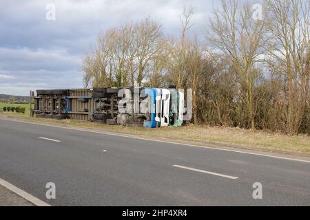 Ashford, Kent, UK. 18 Feb, 2022. UK Weather: Storm Eunice has toppled a British Gypsum lorry on the A259 near Hamstreet in Ashford, Kent. Overturned lorry. Photo Credit: Paul Lawrenson-PAL News /Alamy Live News Stock Photo