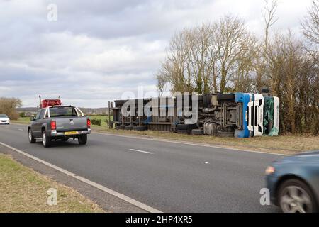 Ashford, Kent, UK. 18 Feb, 2022. UK Weather: Storm Eunice has toppled a British Gypsum lorry on the A259 near Hamstreet in Ashford, Kent. Overturned lorry. Photo Credit: Paul Lawrenson-PAL News /Alamy Live News Stock Photo