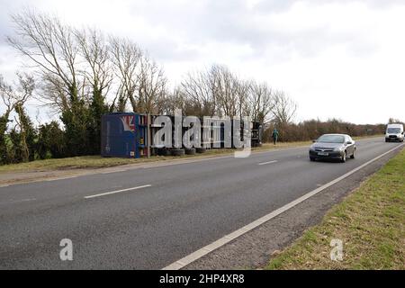 Ashford, Kent, UK. 18 Feb, 2022. UK Weather: Storm Eunice has toppled a British Gypsum lorry on the A259 near Hamstreet in Ashford, Kent. Overturned lorry. Photo Credit: Paul Lawrenson-PAL News /Alamy Live News Stock Photo