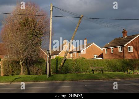 Ashford, Kent, UK. 18 Feb, 2022. UK Weather: A telegraph pole hangs precariously as Storm Eunice passes through the Kent countryside. Hamstreet in Ashford, Kent. Photo Credit: Paul Lawrenson-PAL News /Alamy Live News Stock Photo