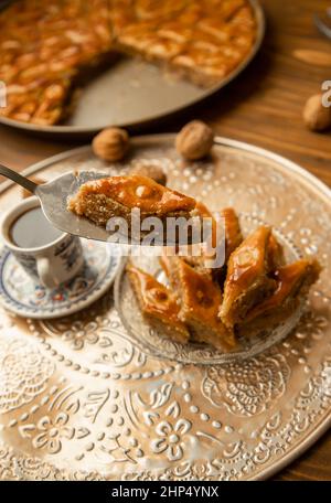 Baklava with nuts on a wooden background. Selective focus. food and drink. Stock Photo