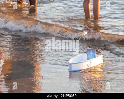 Offerings, objects and holy figures against a dead man in silver on February 2, Yemaya day, Jemanja, Stock Photo