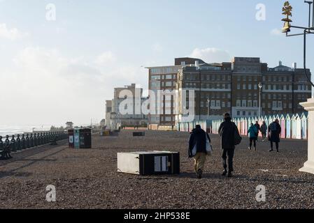 Brighton & Hove, East Sussex. 18th February 2022, 2022. UK Weather. Storm Eunice starts to ease, but leaves pebbles and waste bins strewn all over the Hove seafront promenade. The Met Office has issued a red warning due to ‘hurricane-style winds of up to 90mph’. Credit: Francesca Moore/Alamy Live News Stock Photo