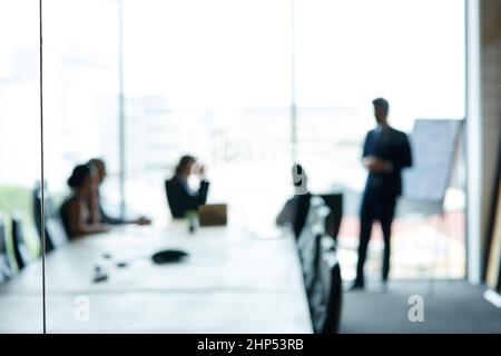 Corporate movers and shakers in action. Shot of a group of executives having a meeting in a boardroom. Stock Photo