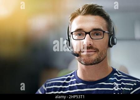 How may I direct your call. Cropped portrait of a businessman wearing a headset. Stock Photo
