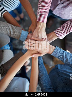 Lets do this team. Modern office space with candid creative business people interacting with each other. Stock Photo
