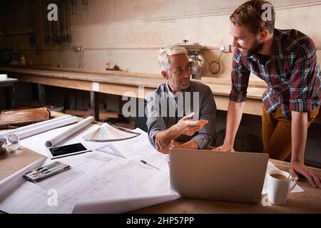 Turning his vision into reality. An architect drawing up plans. Stock Photo