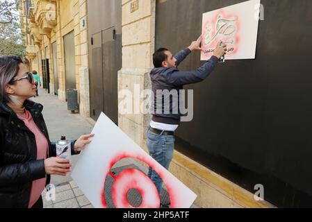 Beirut, Lebanon. 18th Feb, 2022. Depositors protest outside a bank in downtown, Beirut, Lebanon, February 18 2022. Because of Lebanon's financial default, Government and the banks currently apply 'Capital Control law' on people's accounts in Lebanese banks, so they can't withdraw their money or transfer it abroad anymore. Meanwhile Riad Salame, the chief of Lebanese Central Bank, is wanted by many Countries' police, including Lebanon and Luxembourg. (Photo by Elisa Gestri/ Credit: Sipa USA/Alamy Live News Stock Photo