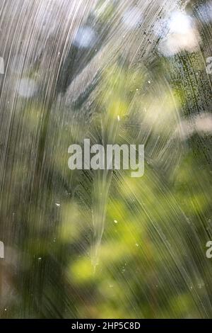 Dirty glass. Window is covered with dust. Plaque on surface. Cleaning details. Texture unwashed window. Background stains from dirt. Stock Photo