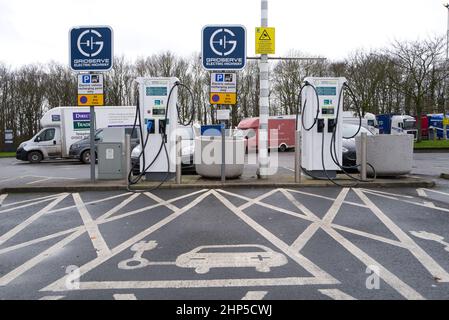 Electric vehicle charging at Trowell Motorway Service Stations on the M1 in Northern England Stock Photo