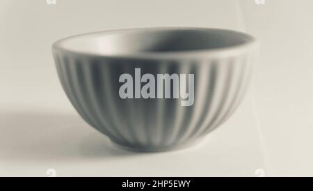 Monochrome image of small pot against plain background with copy space Stock Photo