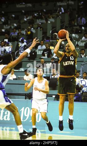 Atlanta, Georgia USA, 1996: Men's basketball at the 1996 Olympic Games in Atlanta. Here a player from Lithuania shoots the ball against Argentina.  ©Bob Daemmrich Stock Photo