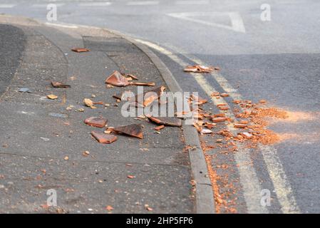 Damage caused by storm Eunice in Southend on Sea, Essex, UK. Roof tiles blown off by strong wind and smashed on the ground. Broken pieces Stock Photo