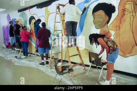Austin, Texas USA: Teens working on mural inside high school for summer project.  ©Bob Daemmrich Stock Photo