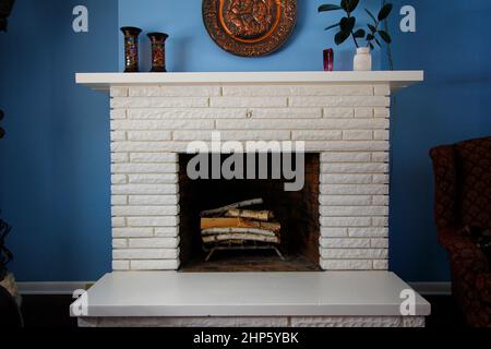 blue wall white fireplace