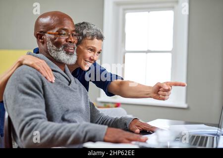 Working on their finances together. Cropped shot of a senior couple working on their finances at home. Stock Photo