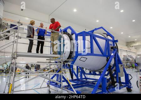 A mockup of the cargo logistics module for Sierra Nevada Corporation’s Dream Chaser, the company’s reusable spaceplane, arrived at the Space Station Processing Facility (SSPF) at NASA’s Kennedy Space Center in Florida in August. On Sept. 20, 2019, senior leadership had the opportunity to view the cargo module in the SSPF high bay. From left are Kennedy Deputy Director Janet Petro; Steve Lindsey, vice president, Space Exploration Systems, Sierra Nevada Corporation; and Kelvin Manning, Kennedy associate director, technical. The SSPF is providing support for current and future NASA and commercial Stock Photo